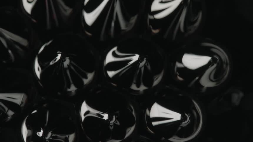 Black magnetic liquid forming patterns