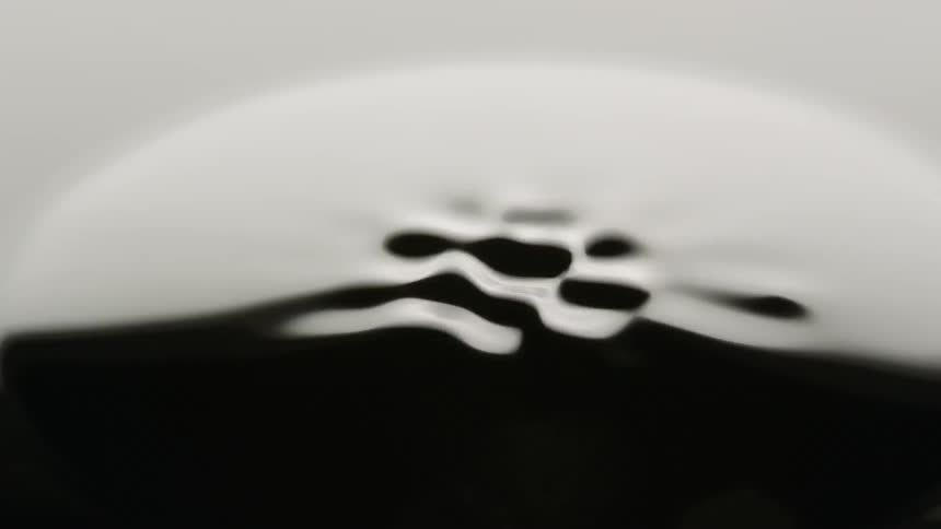 Black liquid forming patterns in a bowl