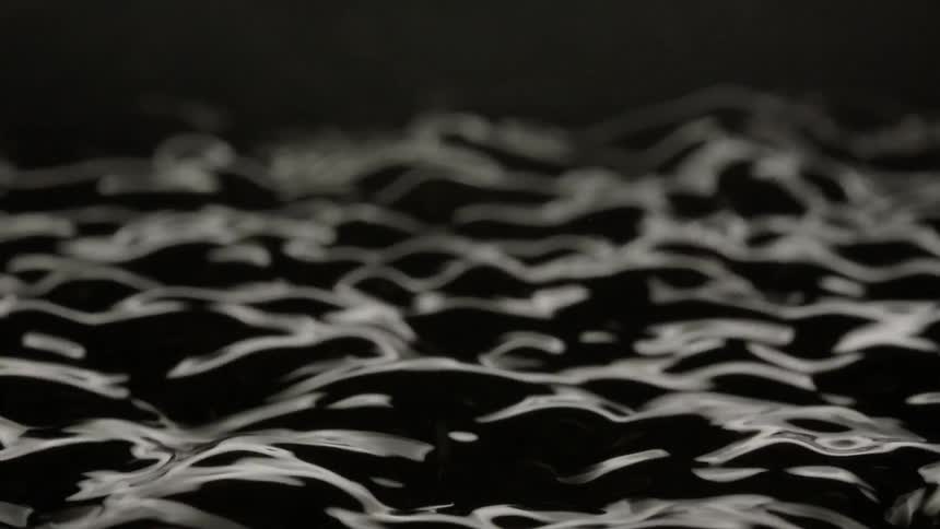 A dancing black liquid