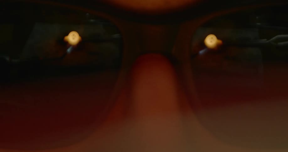 Light reflects off a pair of black sunglasses