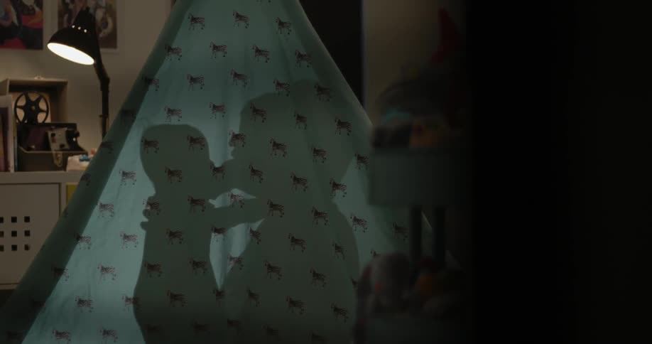 Shadow of a women playing with a baby