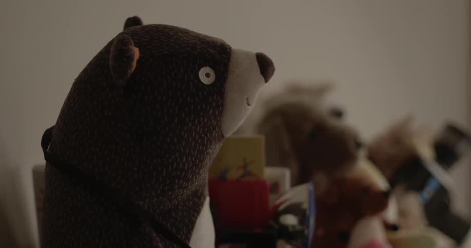Side view of creepy bear stuffed animal