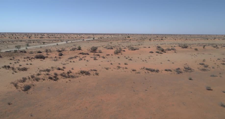 A road runs through an area of desert