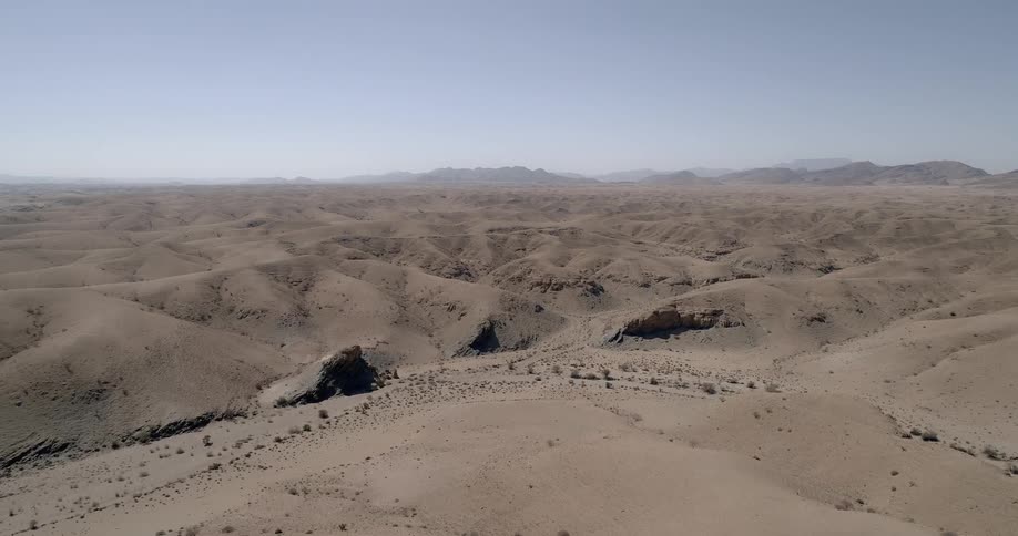 An aerial view of a hilly desert landscape