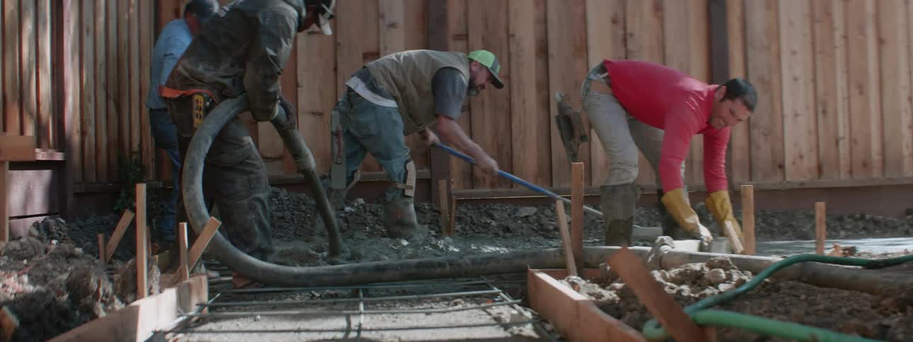 A group of hispanic men doing construction work