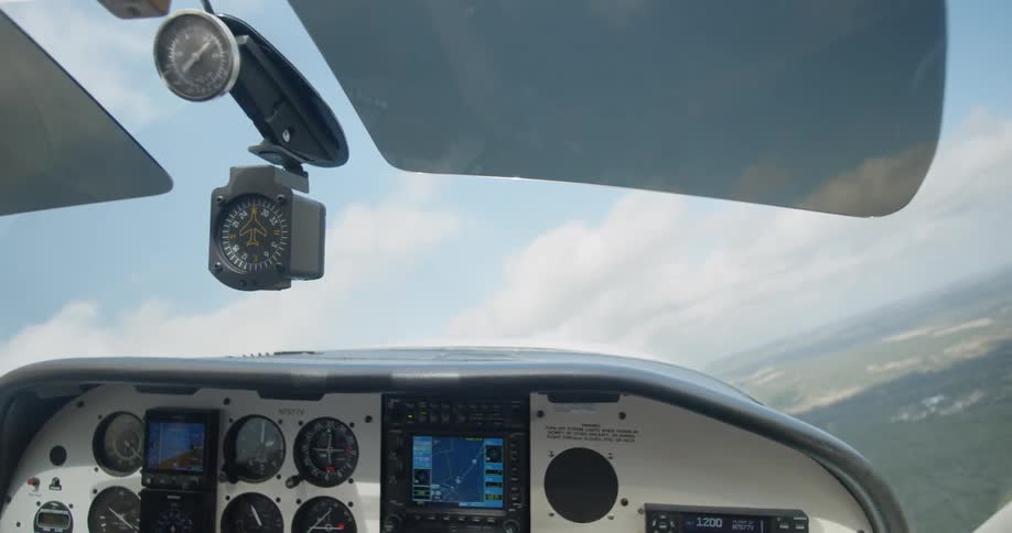 A plane flying over a rural area