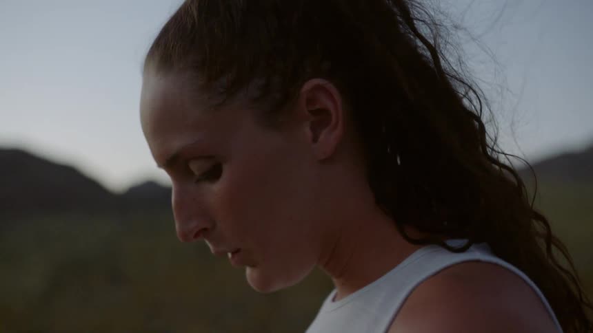 A woman exhales deeply