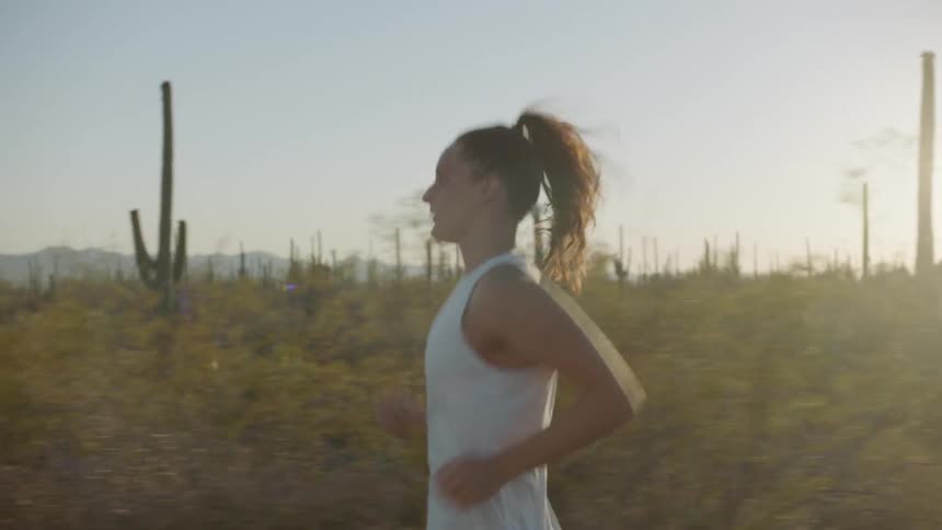 A woman runs in the desert