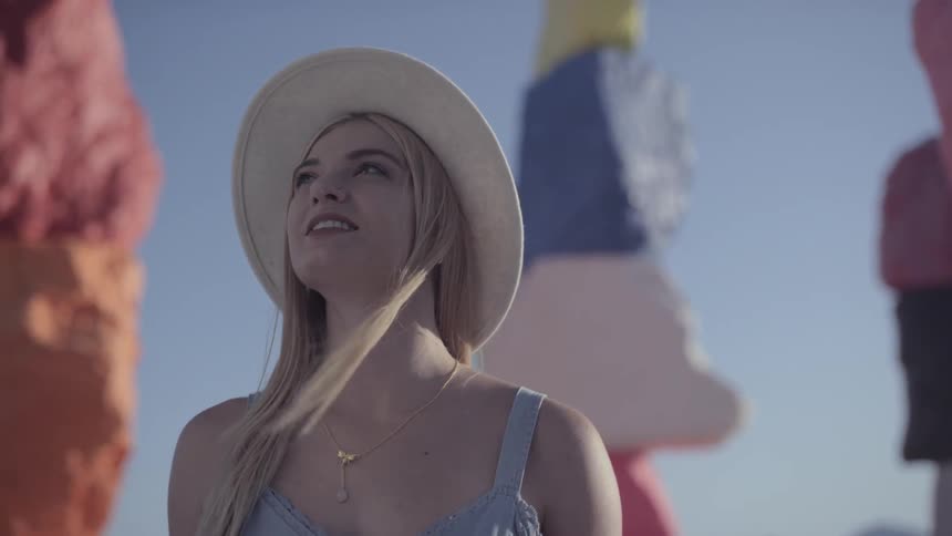 A woman looks up towards the sky