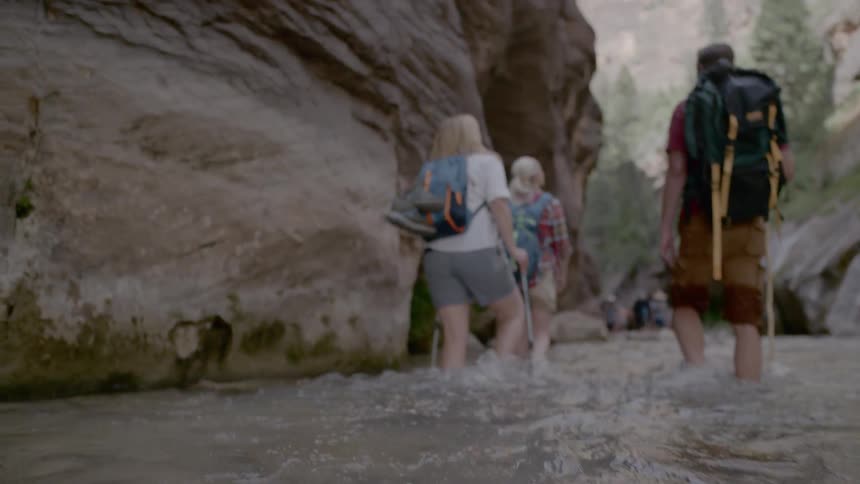 People walk through the water