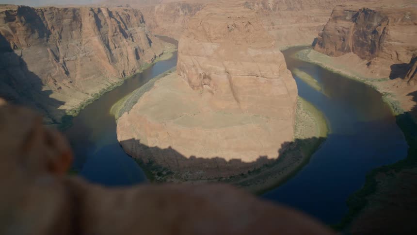 A rock formation in the middle of water