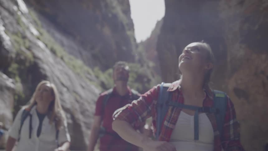 Three people are viewing the canyon