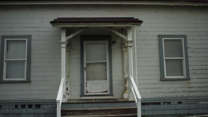 Walking up to an old white house