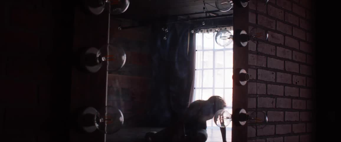 Dancer falls while twirling in front of a mirror