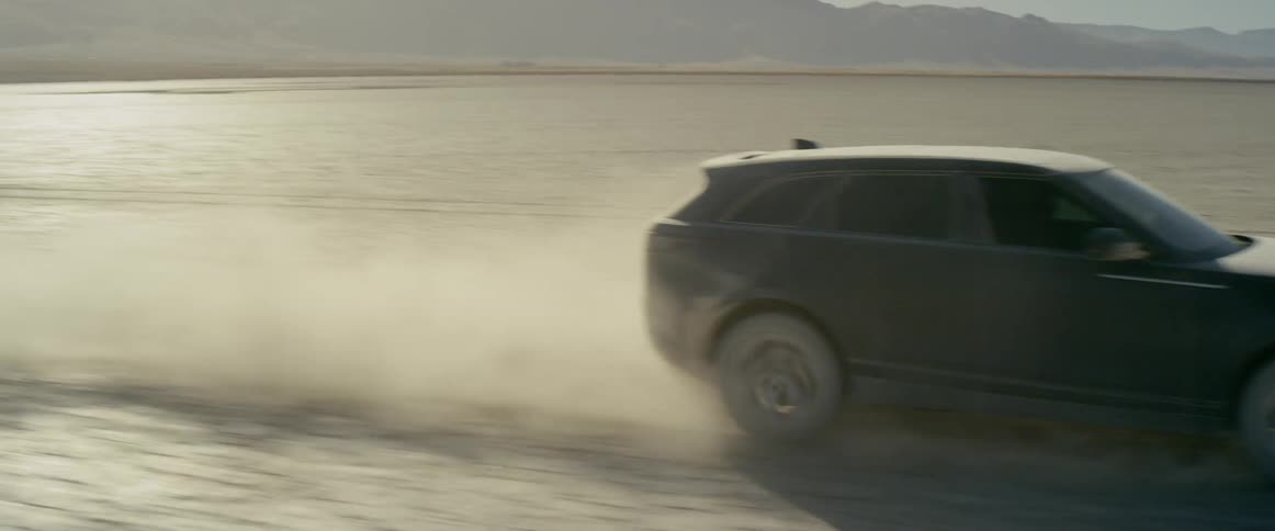 Vehicle driving fast through the desert