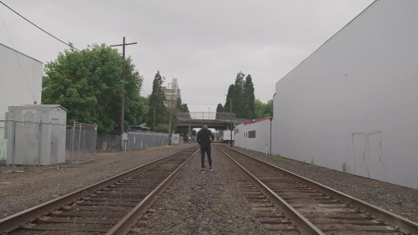 A man walk in the rail road
