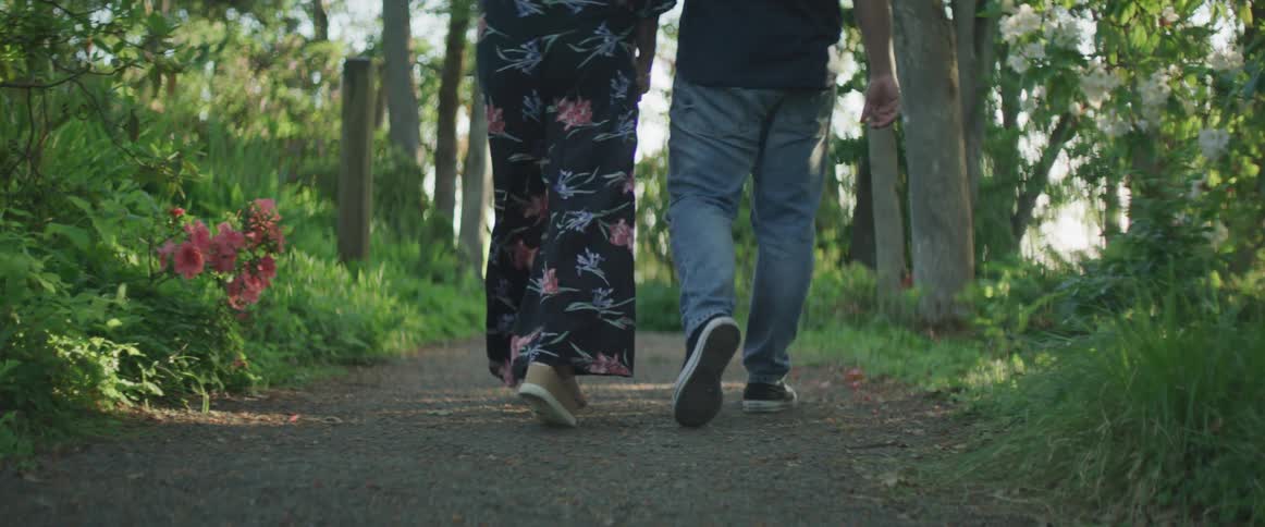 A couple walks down the path