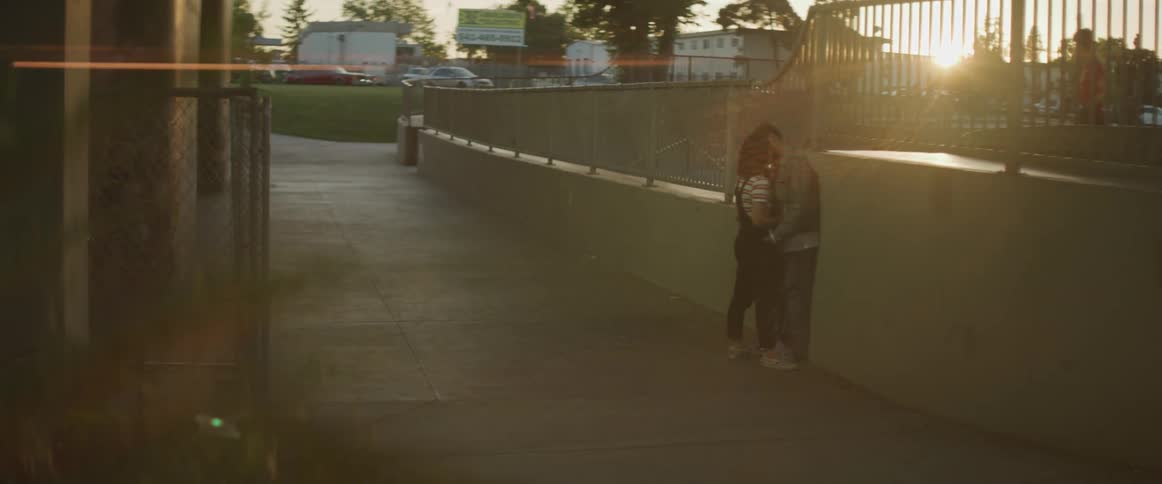 A couple kissing at dawn in the public
