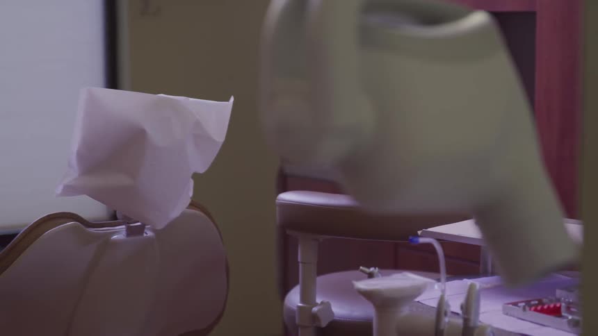 A dentist office with chairs and equipment