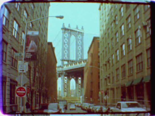 A bridge can be seen beyond a city street
