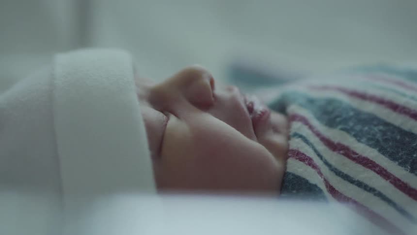 A baby sleeping with blanket