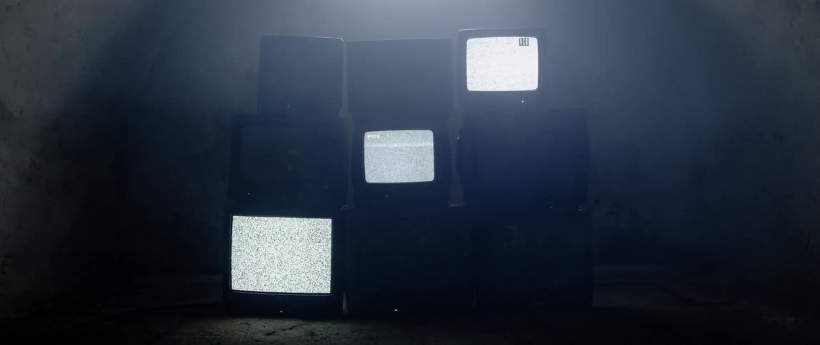 Televisions are stacked on top of each other