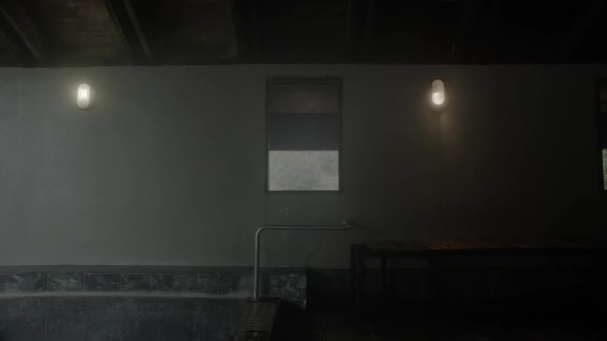 A mirror on a wall with lights on either side with a chrome hand bar beneath