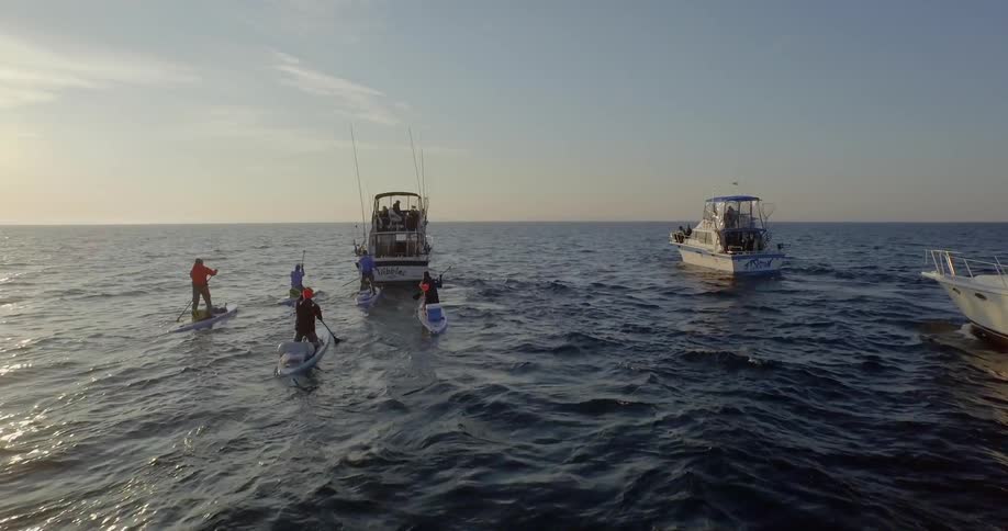 People in boats out on the ocean
