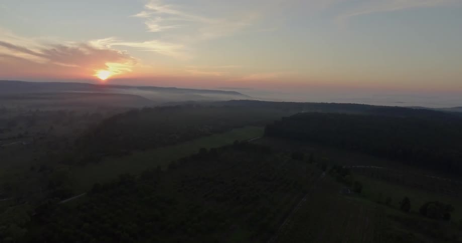 Aerial view of a sunset over farmland
