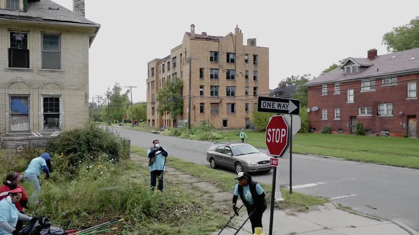 People cleaning up a neighborhood