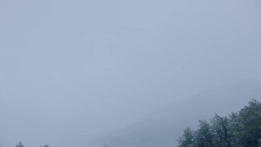 Fog that is over some hills and forest