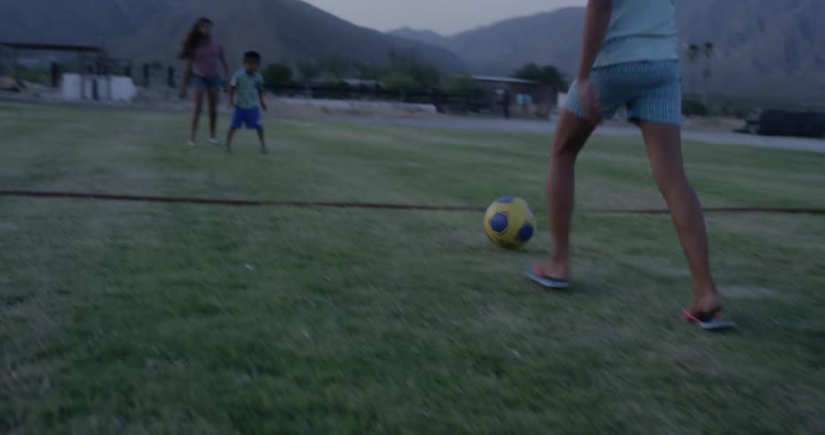 Children play soccer together