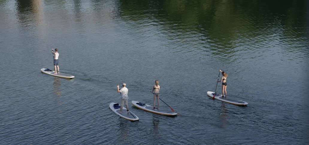People are on the lake using a type of boat