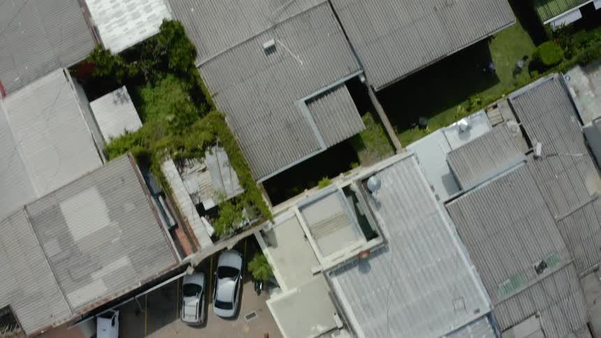 Flying over some houses in a city