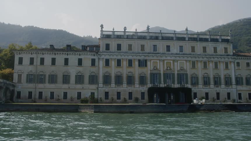 Waterfront vintage palace surrounded by mountains
