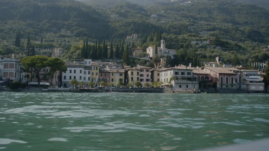 A town sits right on the shore of a body of water