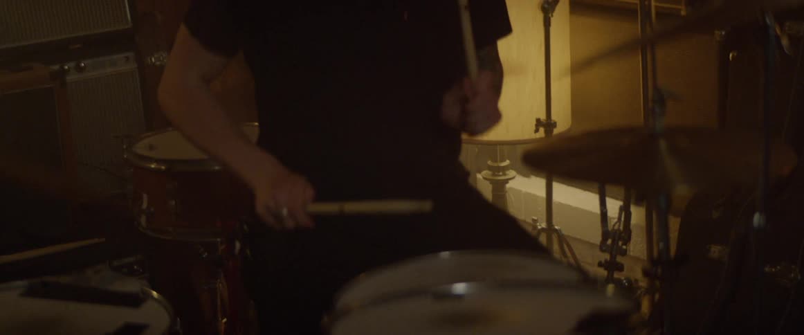 A man plays the drums
