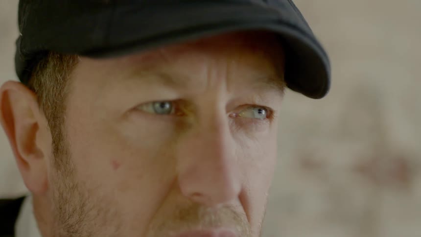 A man stares straight ahead