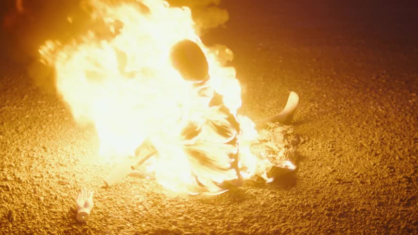 A mannequin on fire outside