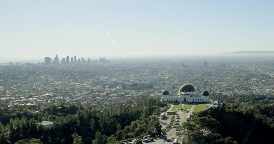 Establishing aerial shot of the Griffith Observatory overlooking Downtown Los Angeles