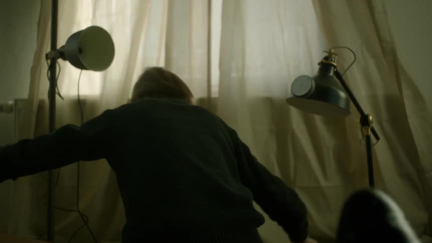 A person is using tape indoors