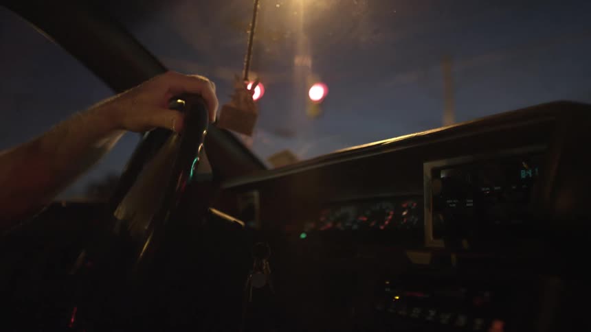 A hand on a steering wheel