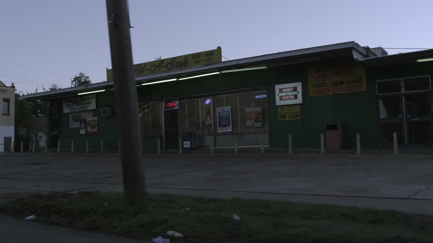 Fluorescent lights flicker on a retail store