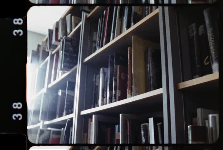Several library shelves hold a large number of books