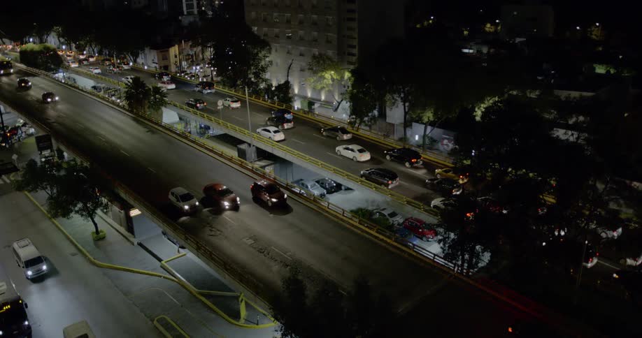 An overpass through a city at night
