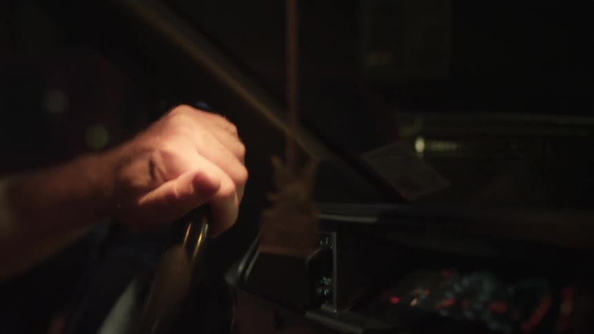 Man driving his car at night