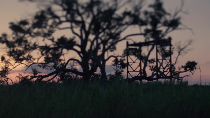 The sun sets over a rural area