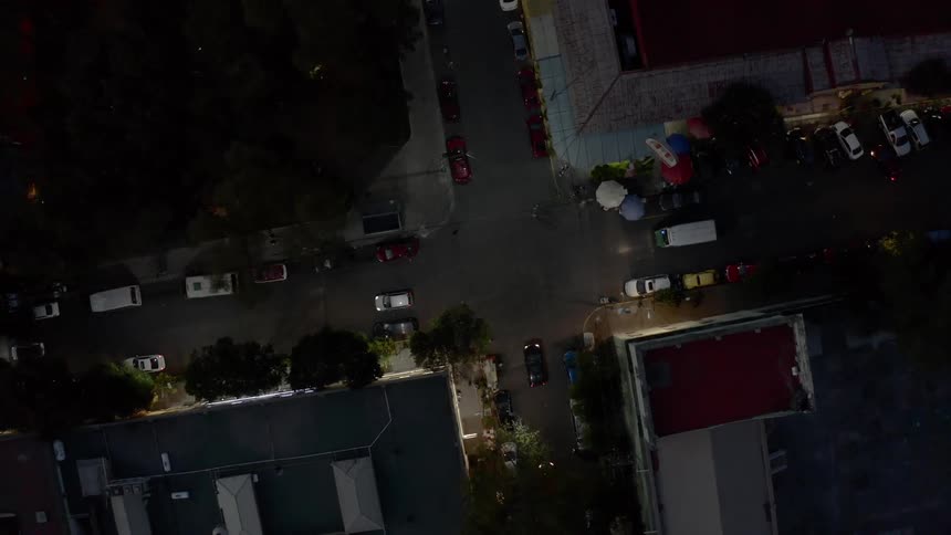 An aerial view of cars driving through a city