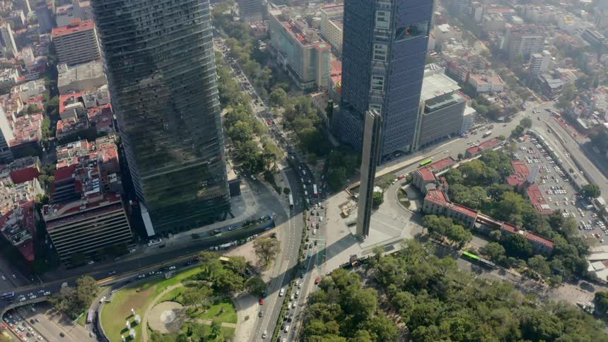 Birds eye view of cars driving in a downtown area
