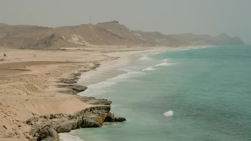 The ocean waves over the beach